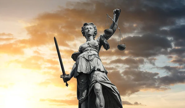 depositphotos_178495216-stock-photo-statue-of-lady-justice-justitia